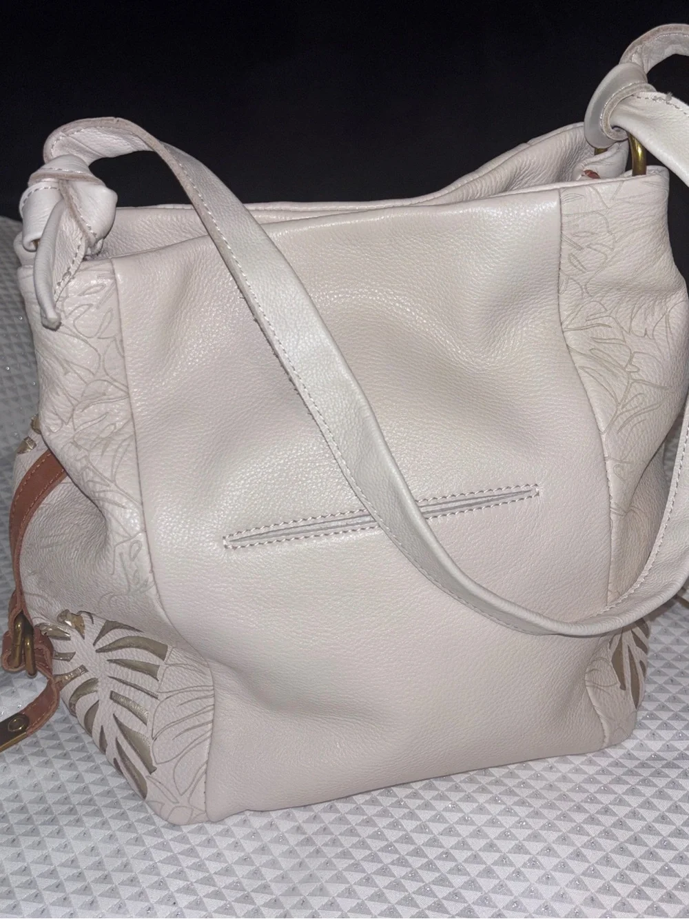 The Sak Cream Leather Shoulder Bag with Floral Cutout Accents